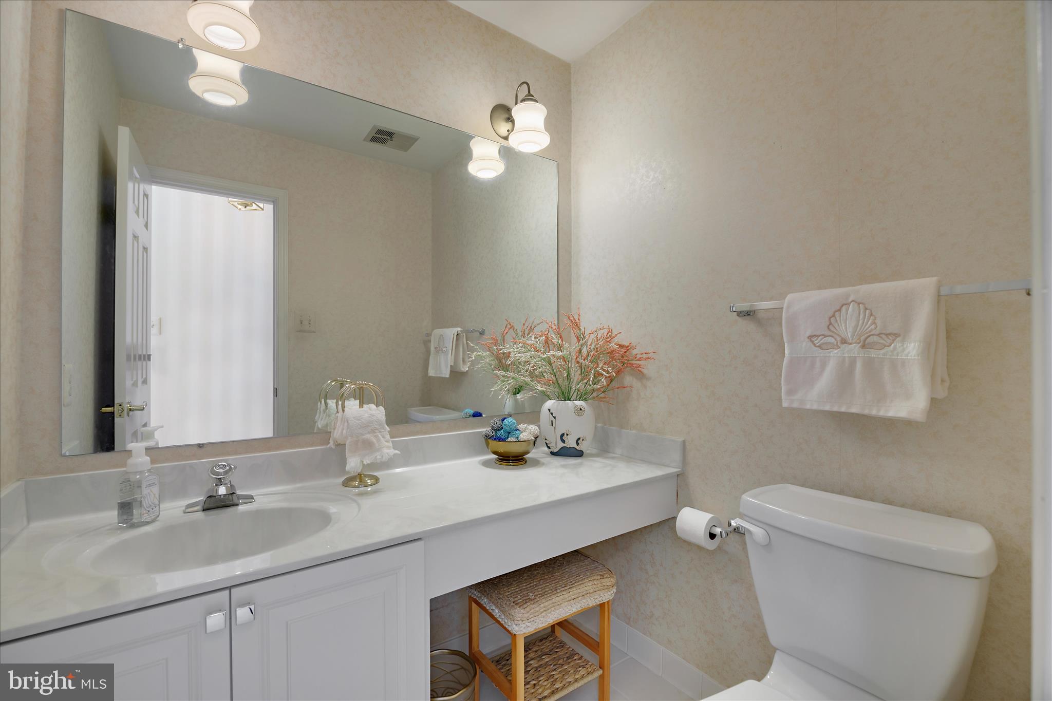 253 Milthorn Court Riva, MD 21140 - Photo 31 of 71 a bathroom with a granite countertop sink a toilet and a mirror