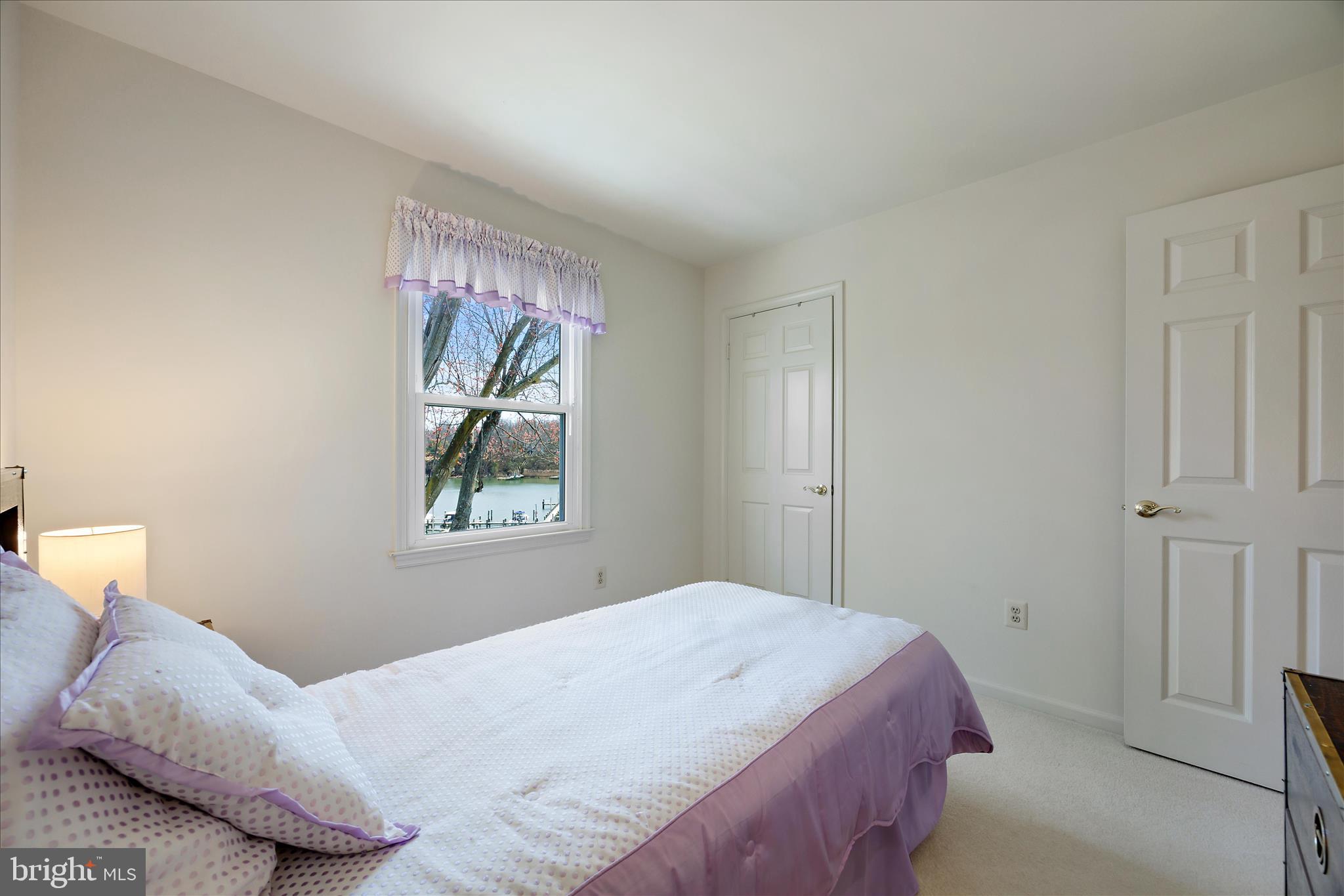 253 Milthorn Court Riva, MD 21140 - Photo 36 of 71 a bedroom with a bed and a painting on the wall