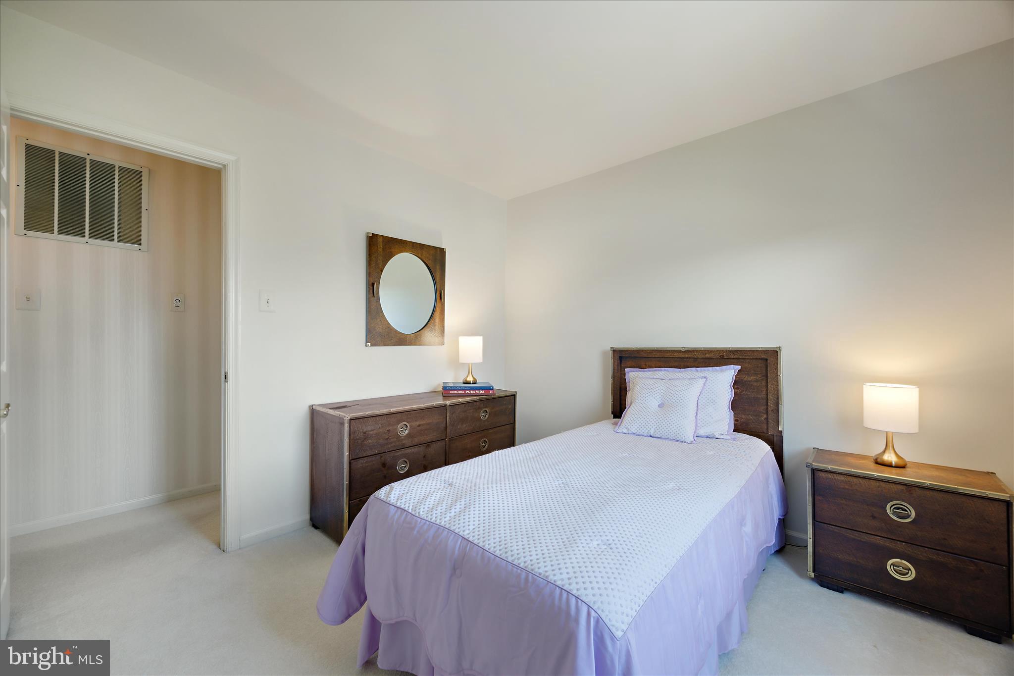 253 Milthorn Court Riva, MD 21140 - Photo 38 of 71 a bedroom with a bed and a dresser