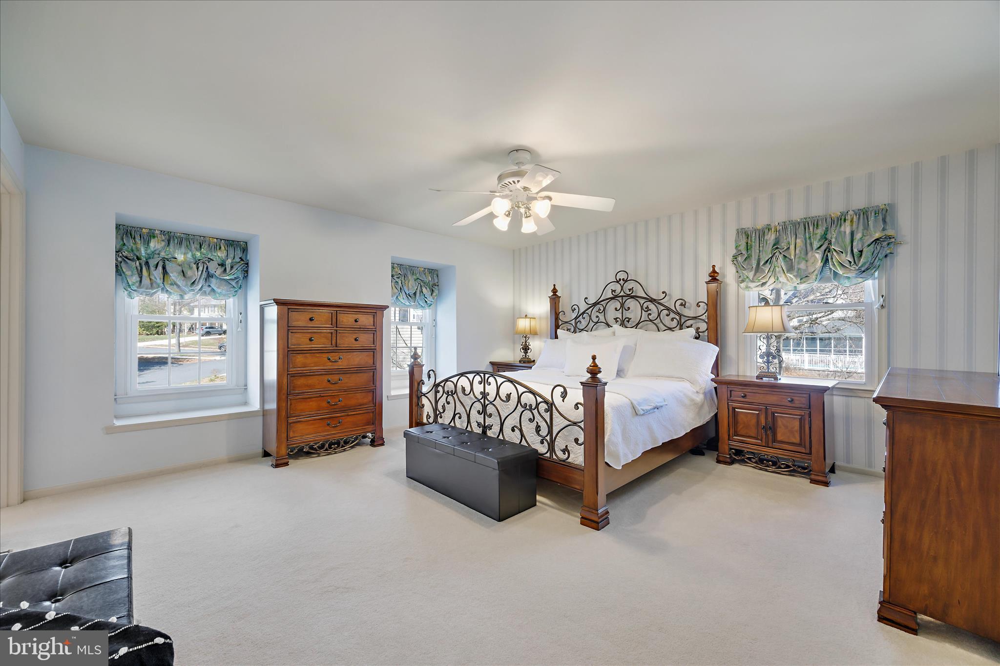 253 Milthorn Court Riva, MD 21140 - Photo 42 of 71 a bedroom with a bed and a chandelier