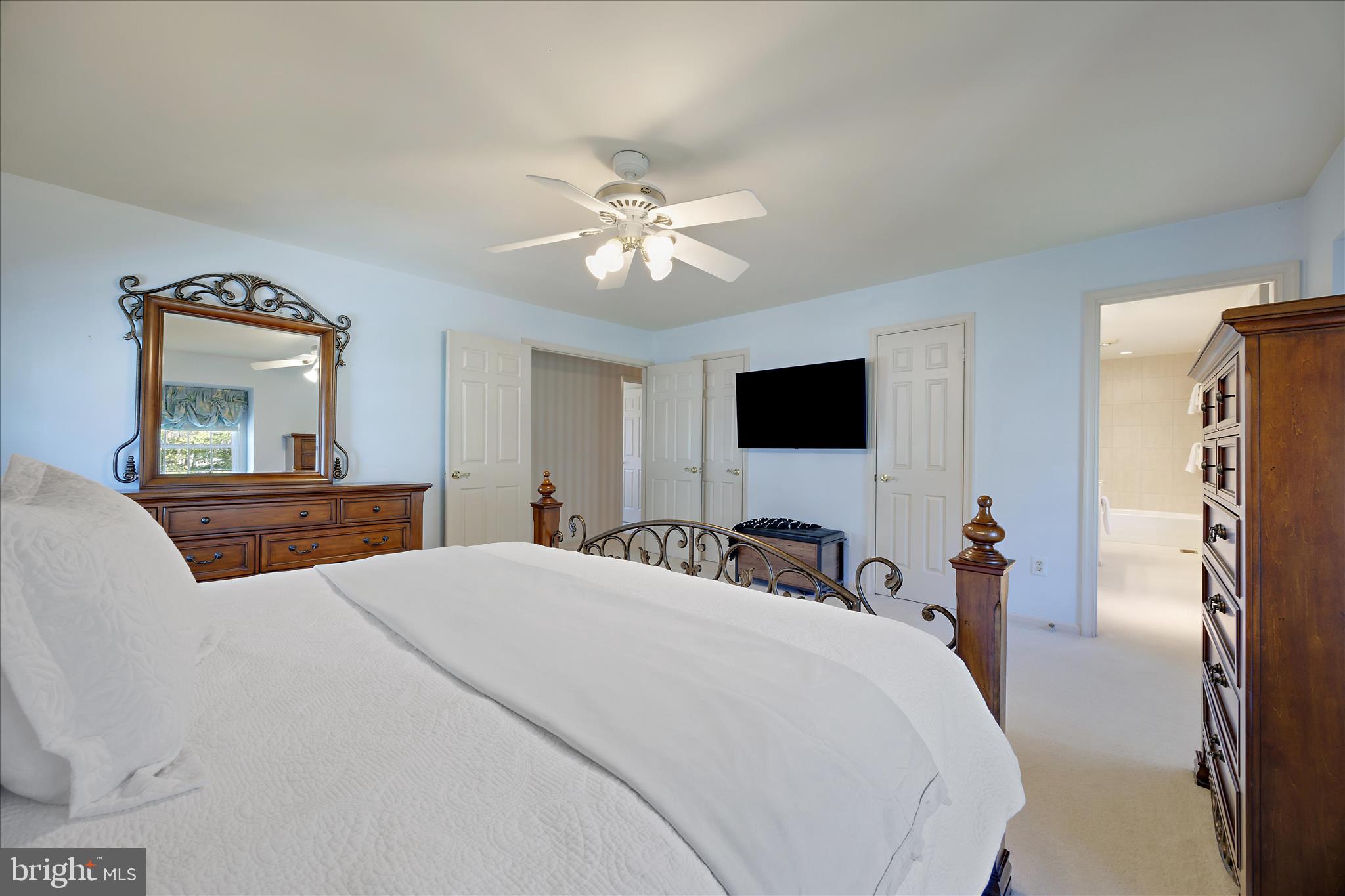 253 Milthorn Court Riva, MD 21140 - Photo 44 of 71 a bedroom with a bed and a flat screen tv