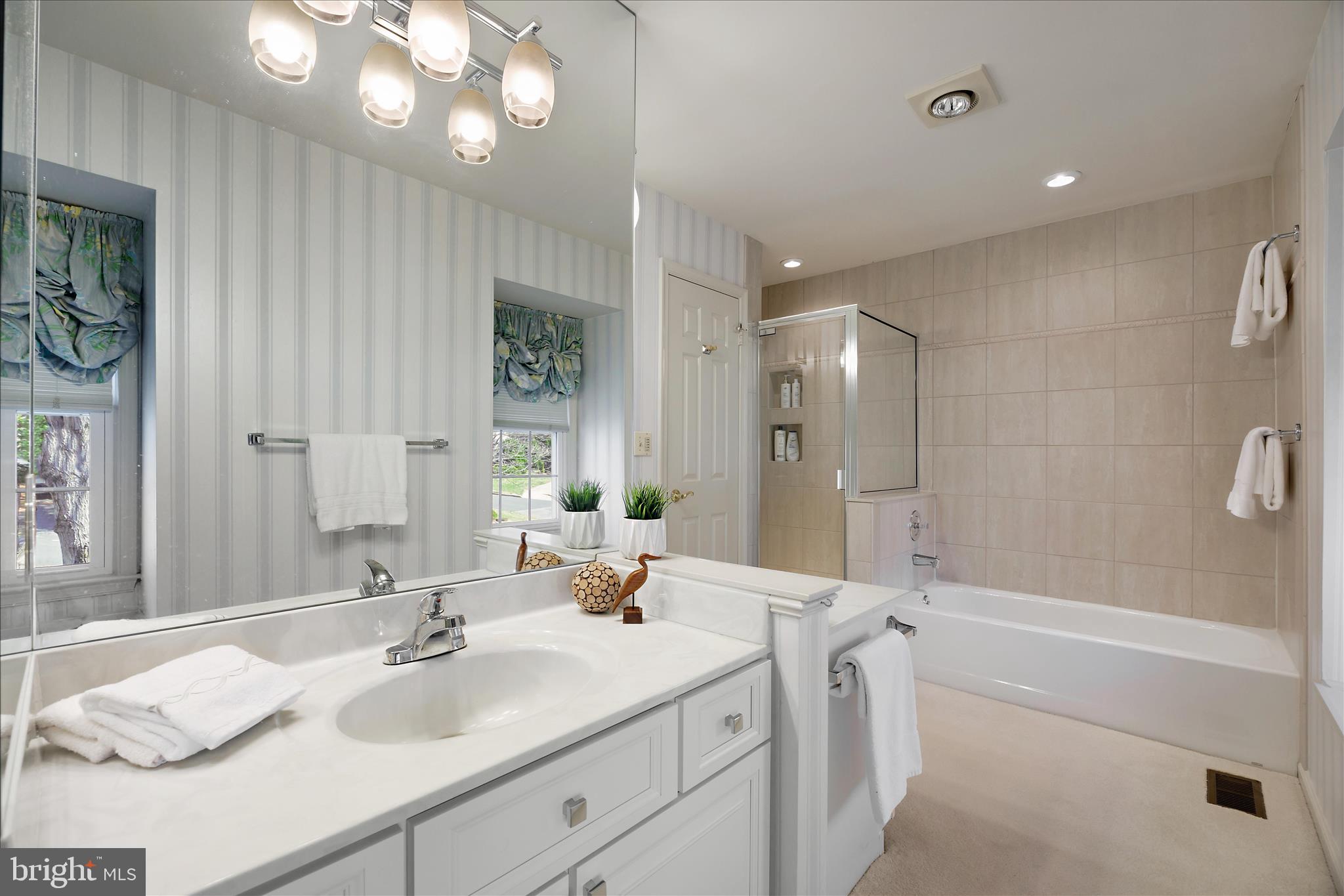 253 Milthorn Court Riva, MD 21140 - Photo 47 of 71 a bathroom with a double vanity sink mirror and shower