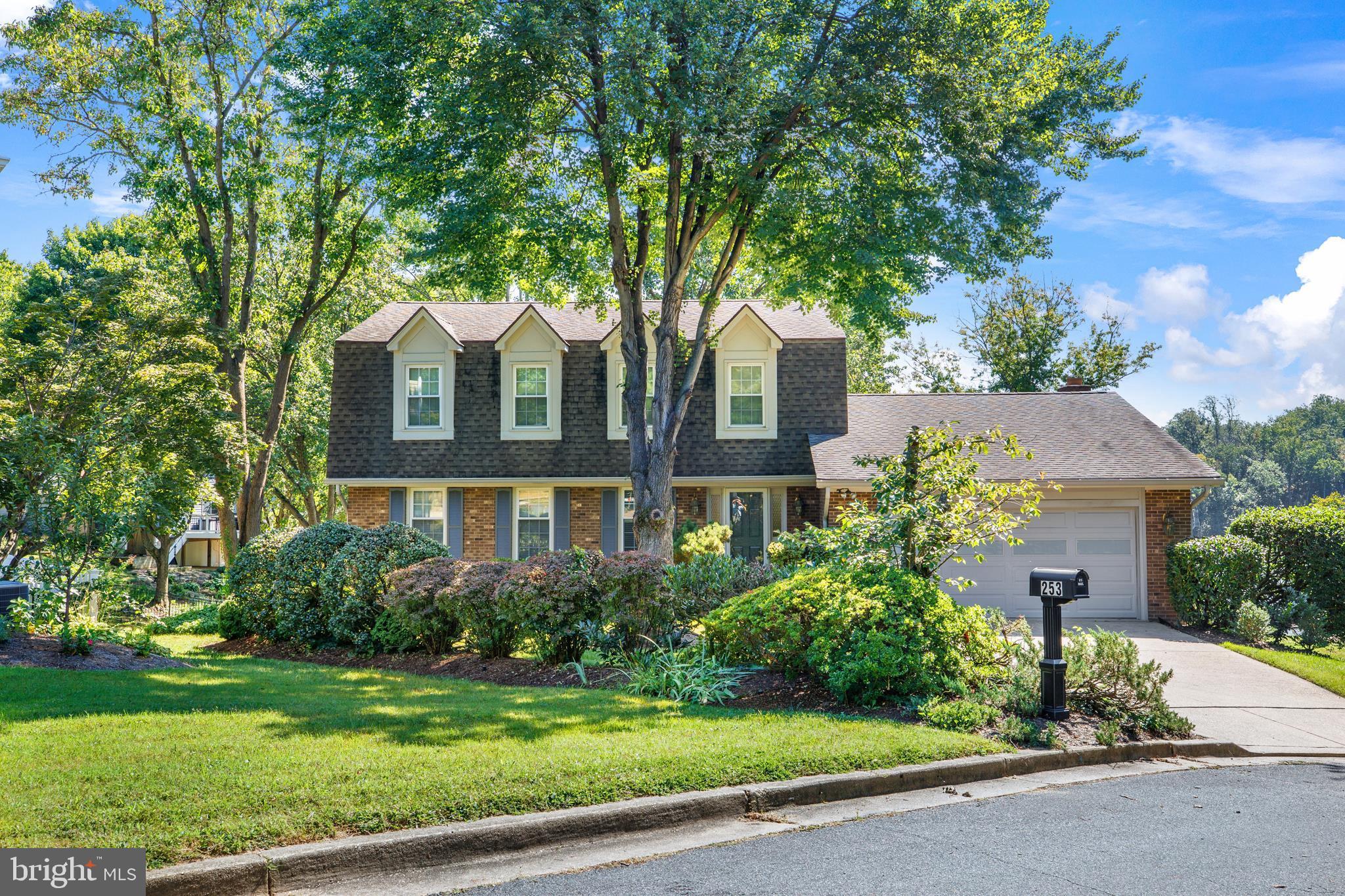 253 Milthorn Court Riva, MD 21140 - Photo 6 of 71 a front view of a house with a garden