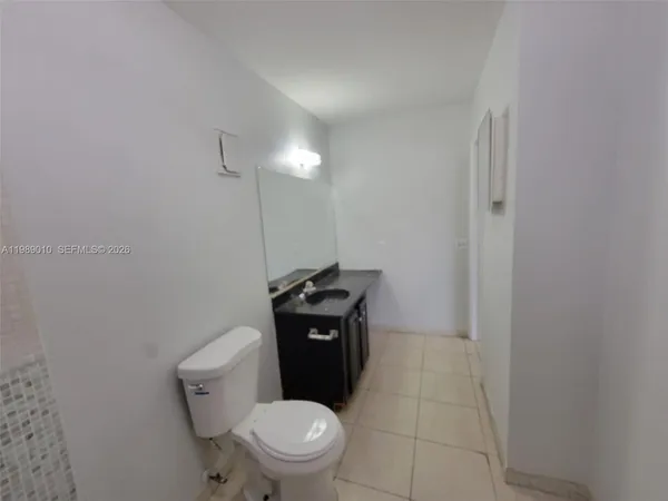 a bathroom with a toilet and a sink