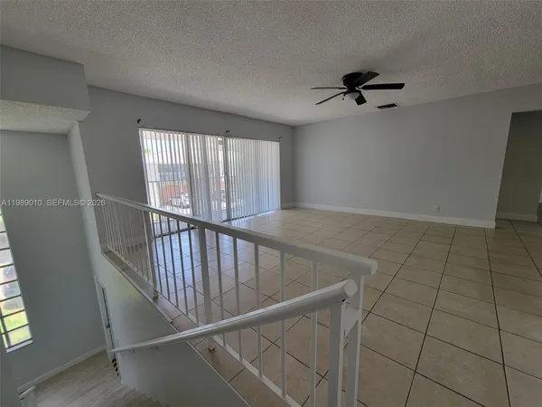 a view of a hallway with a window
