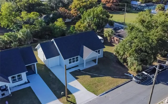 a kitchen with stainless steel appliances granite countertop a refrigerator sink and cabinets