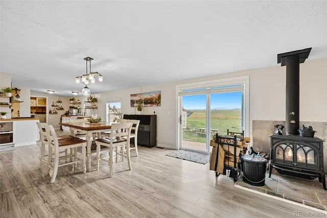a view of a dining room with furniture window and outside view