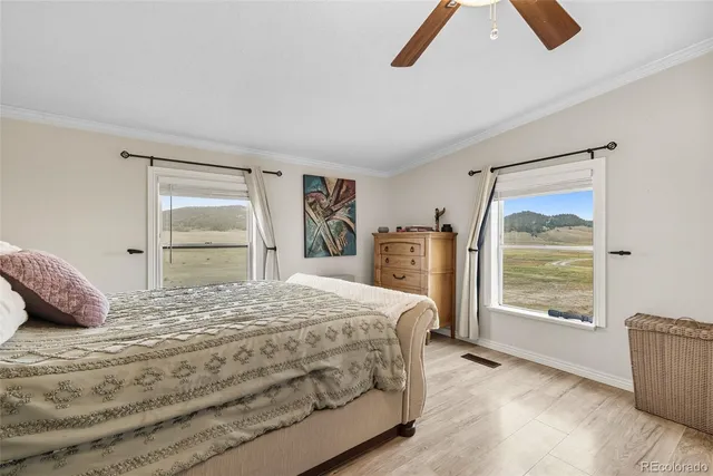 a bedroom with a large bed and a window