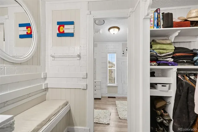 a kitchen with a refrigerator and cabinets