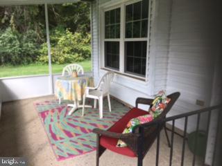 7022 Basswood Road Frederick, MD 21703 - Photo 1 of 8 Front - Screened in Porch