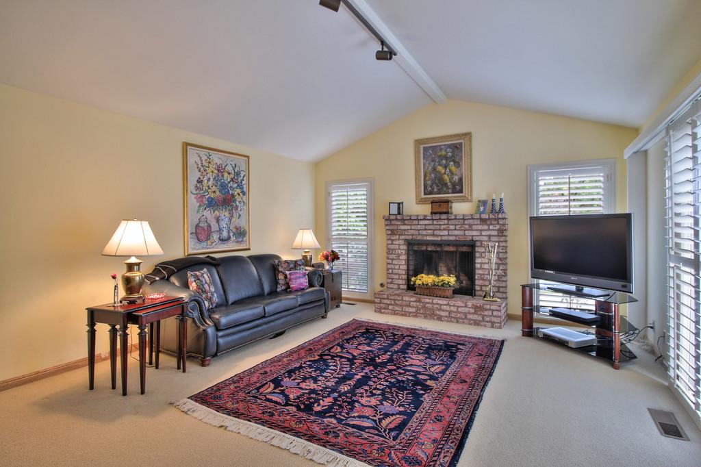1115 Covington Road Los Altos, CA 94024 - Photo 17 of 39 a living room with furniture and a fireplace