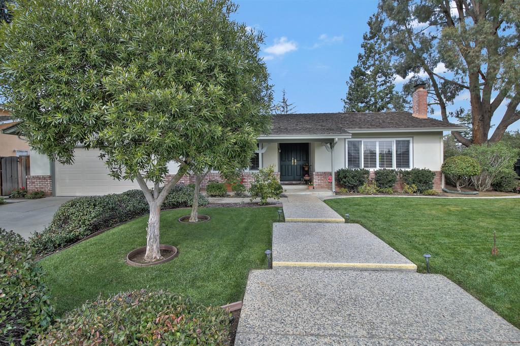 1115 Covington Road Los Altos, CA 94024 - Photo 2 of 39 a front view of house with yard and green space