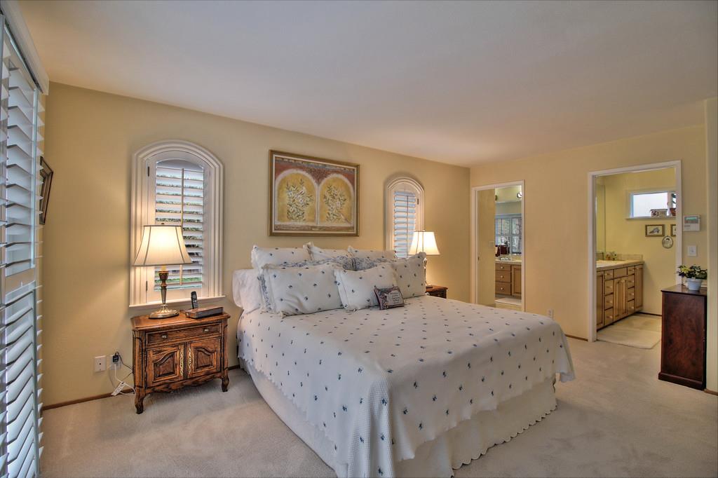 1115 Covington Road Los Altos, CA 94024 - Photo 31 of 39 a bedroom with a bed and a couch