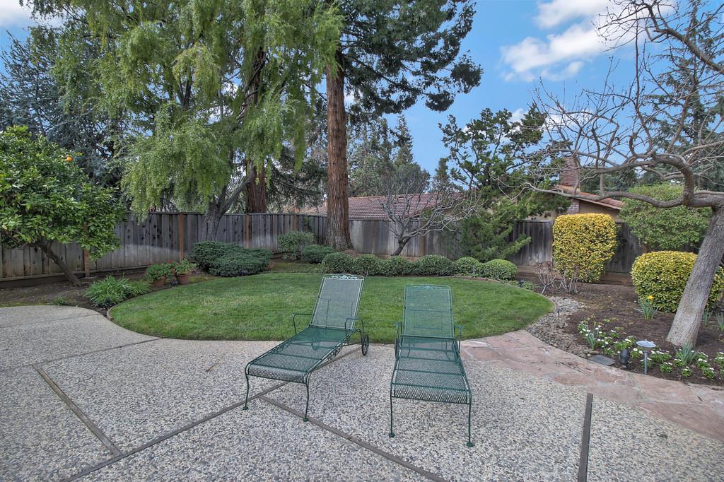 1115 Covington Road Los Altos, CA 94024 - Photo 6 of 39 a view of a park with a bench in a garden