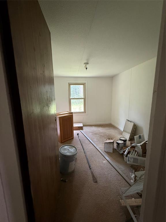 Tbd Pr 1332 Elysian Fields, TX 75642 - Photo 11 of 15 a room with a couch and wooden floor