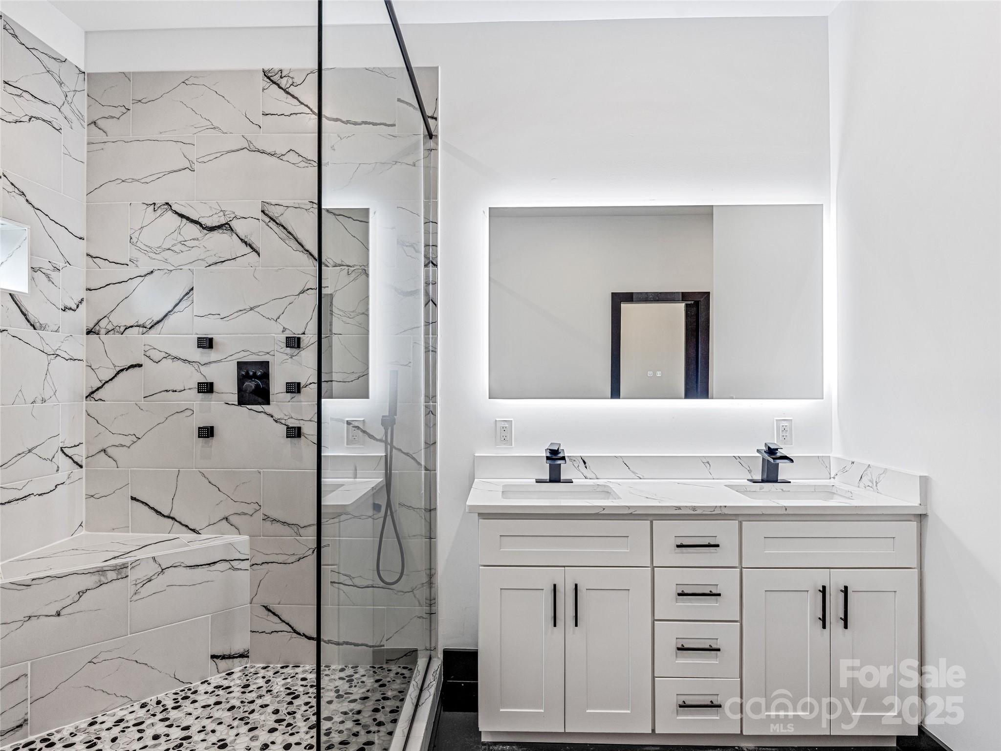 74 Jeranna Road Mills River, NC 28759 - Photo 12 of 42 a bathroom with a double vanity sink mirror and shower