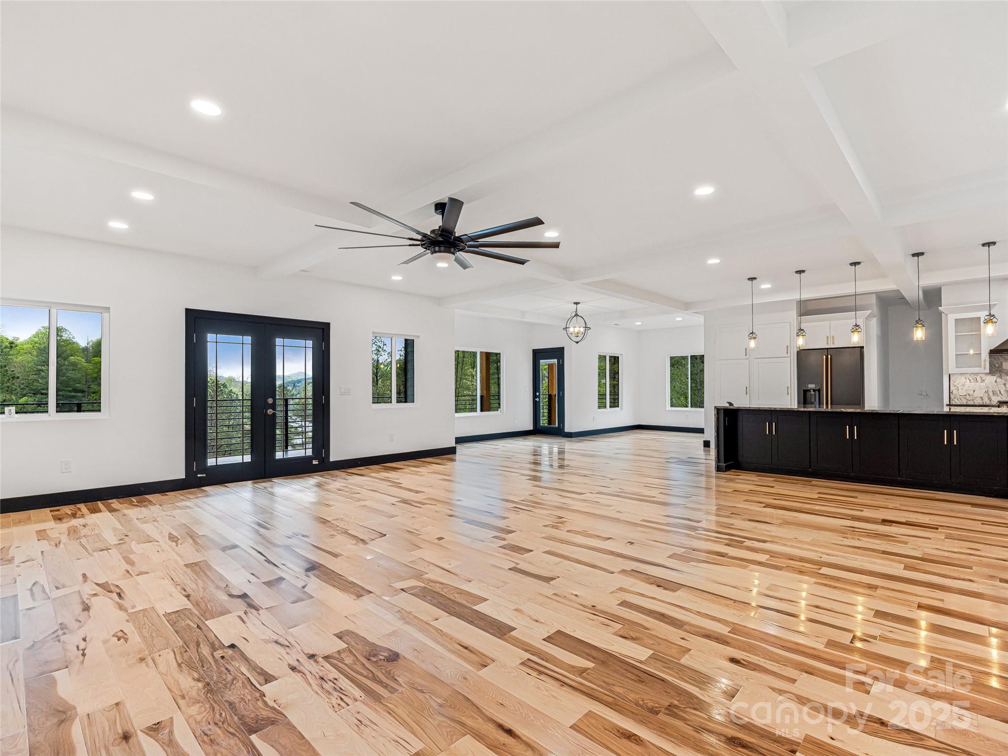 74 Jeranna Road Mills River, NC 28759 - Photo 19 of 42 a view of an empty room with wooden floor and a window