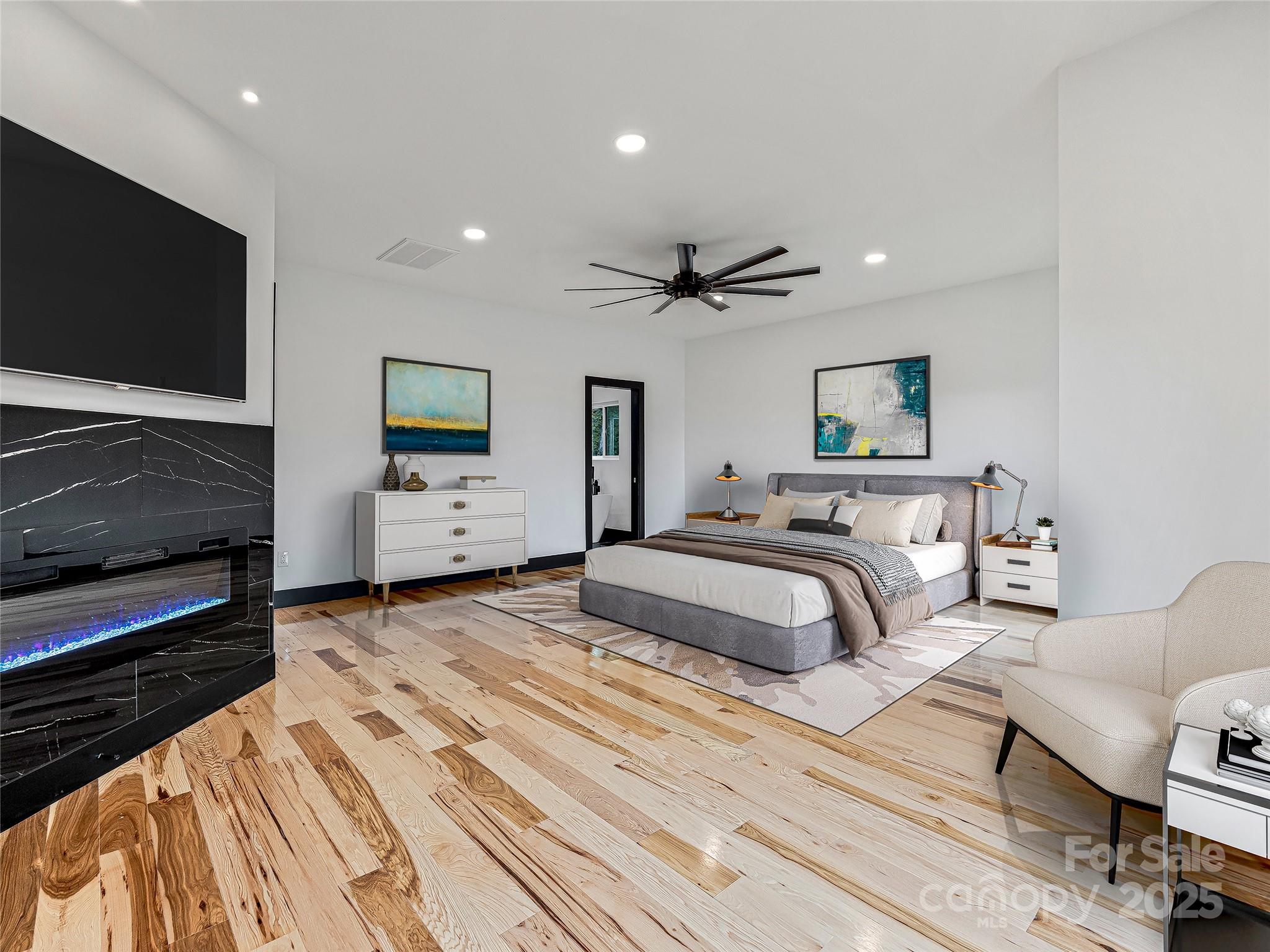 74 Jeranna Road Mills River, NC 28759 - Photo 27 of 42 a bedroom with a bed and a flat screen tv