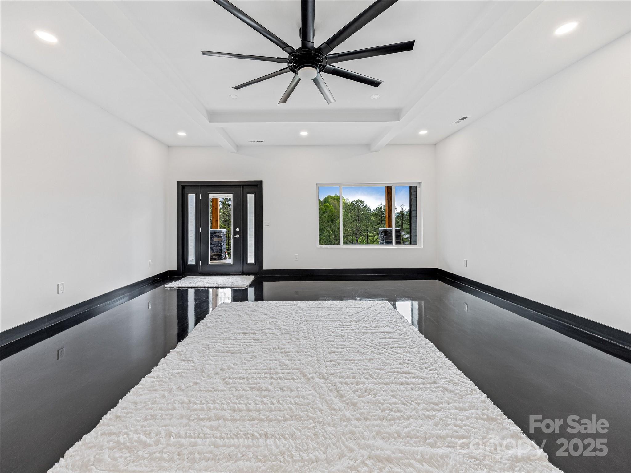 74 Jeranna Road Mills River, NC 28759 - Photo 7 of 42 a bedroom with a bed and a large window with wooden floor