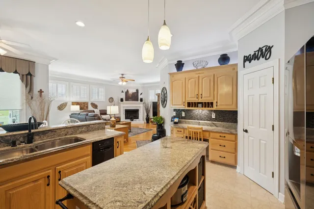 a living room with furniture fireplace and rug