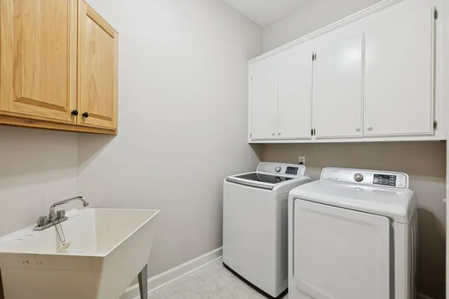 a view of a swimming pool with chairs
