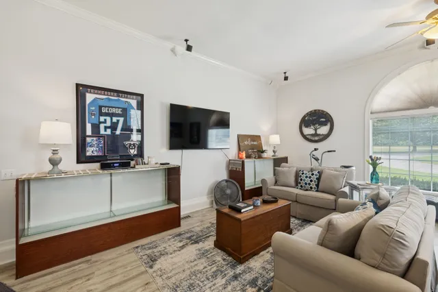a view of a house with a yard and sitting area