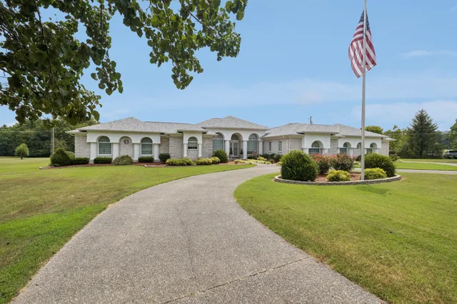 a view of a livingroom with furniture and front door