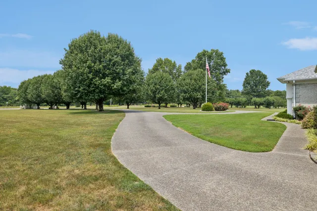 a view of a dining room with furniture and a large window