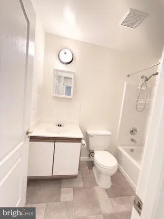 a bathroom with a toilet a sink and a bathtub