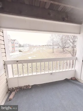 a view of a porch with a bench