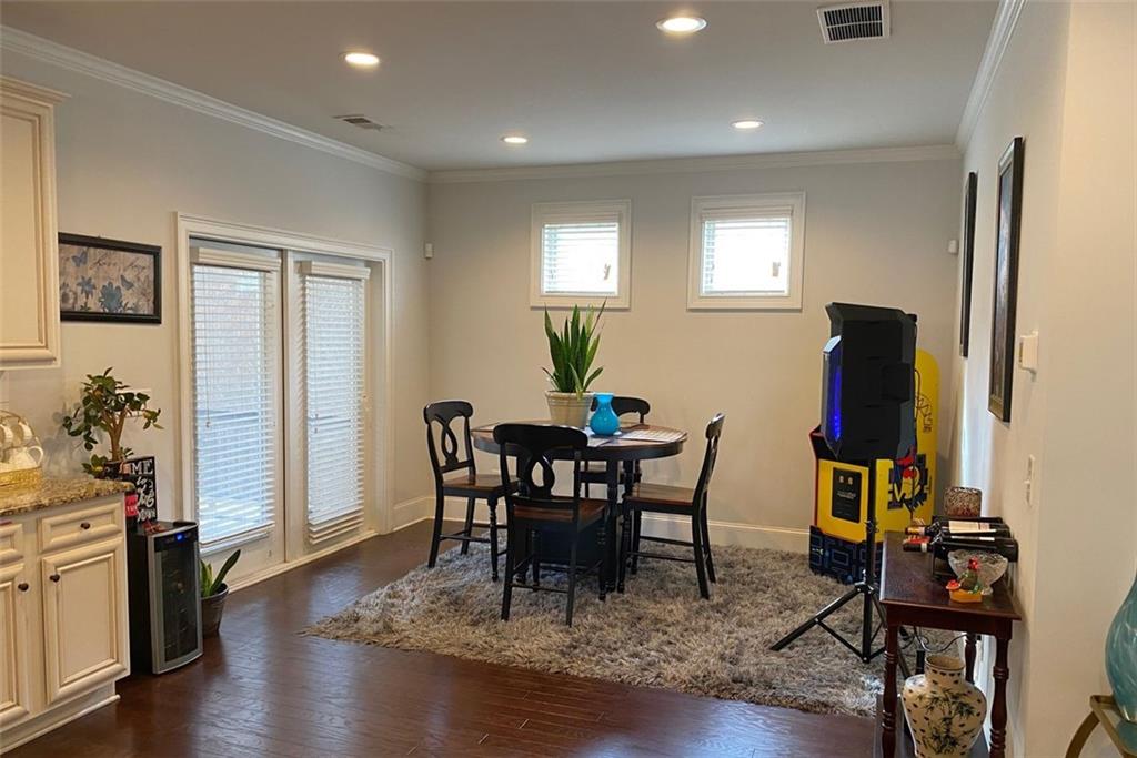 4806 Ralin Court Southwest Atlanta, GA 30331 - Photo 15 of 104 a view of a dining room with furniture and wooden floor