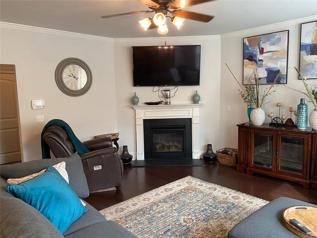 4806 Ralin Court Southwest Atlanta, GA 30331 - Photo 24 of 104 a living room with furniture a flat screen tv and a fireplace