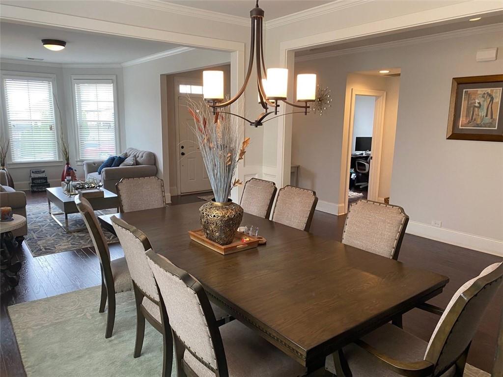 4806 Ralin Court Southwest Atlanta, GA 30331 - Photo 32 of 104 a view of a dining room with furniture and a chandelier