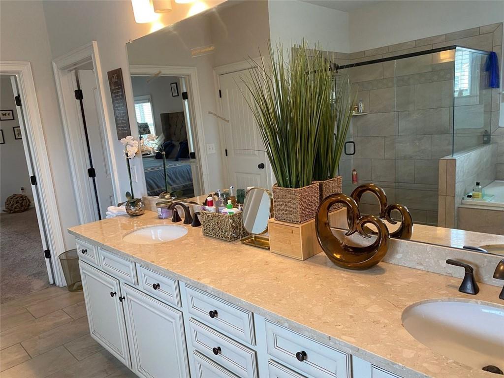 4806 Ralin Court Southwest Atlanta, GA 30331 - Photo 47 of 104 a bathroom with a sink double vanity and a mirror