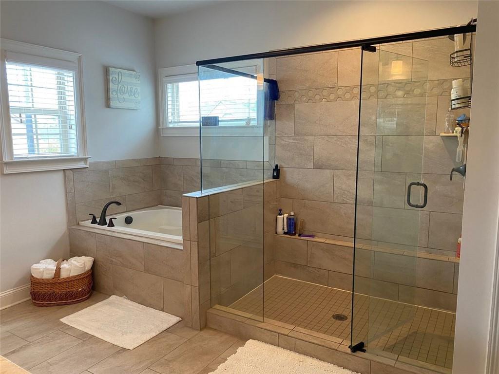 4806 Ralin Court Southwest Atlanta, GA 30331 - Photo 49 of 104 a bathroom with a bath tub and shower