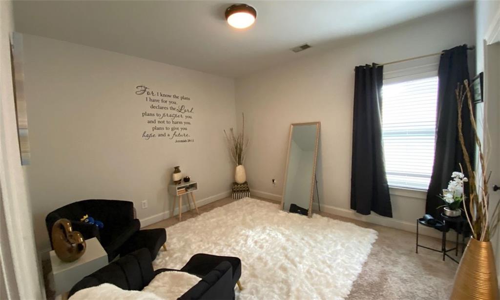 4806 Ralin Court Southwest Atlanta, GA 30331 - Photo 56 of 104 a bedroom with a bed and a large window