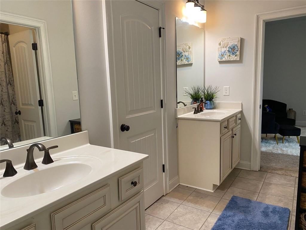 4806 Ralin Court Southwest Atlanta, GA 30331 - Photo 59 of 104 a bathroom with a sink and a mirror
