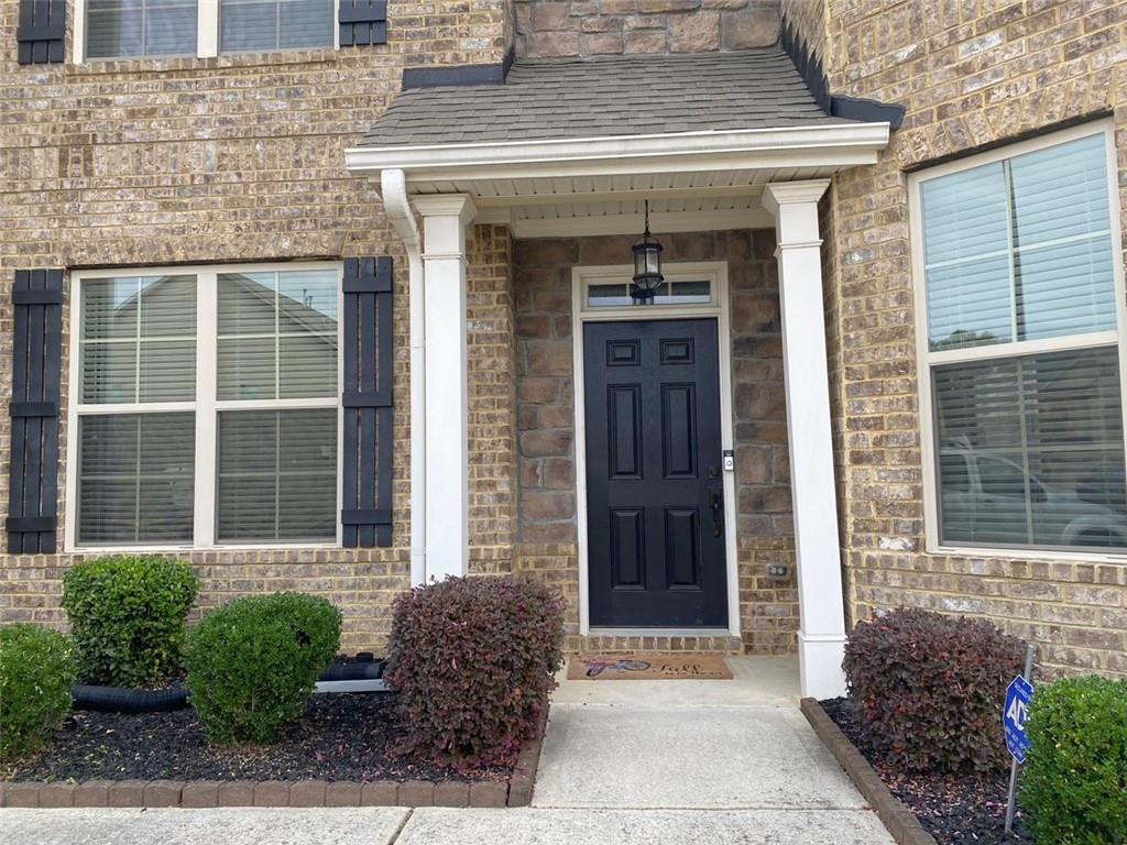 4806 Ralin Court Southwest Atlanta, GA 30331 - Photo 6 of 104 a front view of a house with a garden