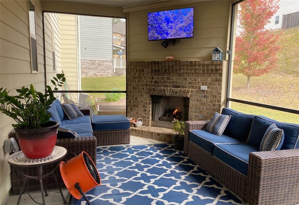 4806 Ralin Court Southwest Atlanta, GA 30331 - Photo 75 of 104 a living room with furniture and a fireplace