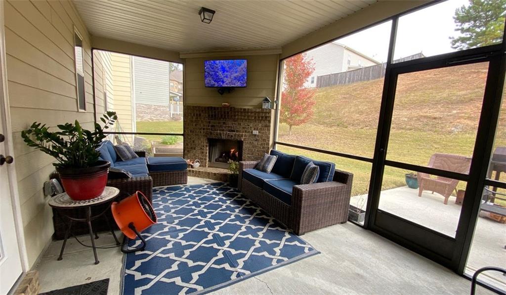 4806 Ralin Court Southwest Atlanta, GA 30331 - Photo 76 of 104 a living room with furniture and a fireplace