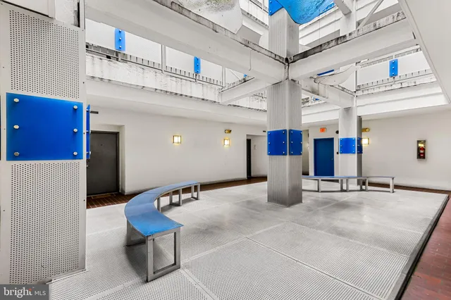 a lobby with furniture and air hockey table