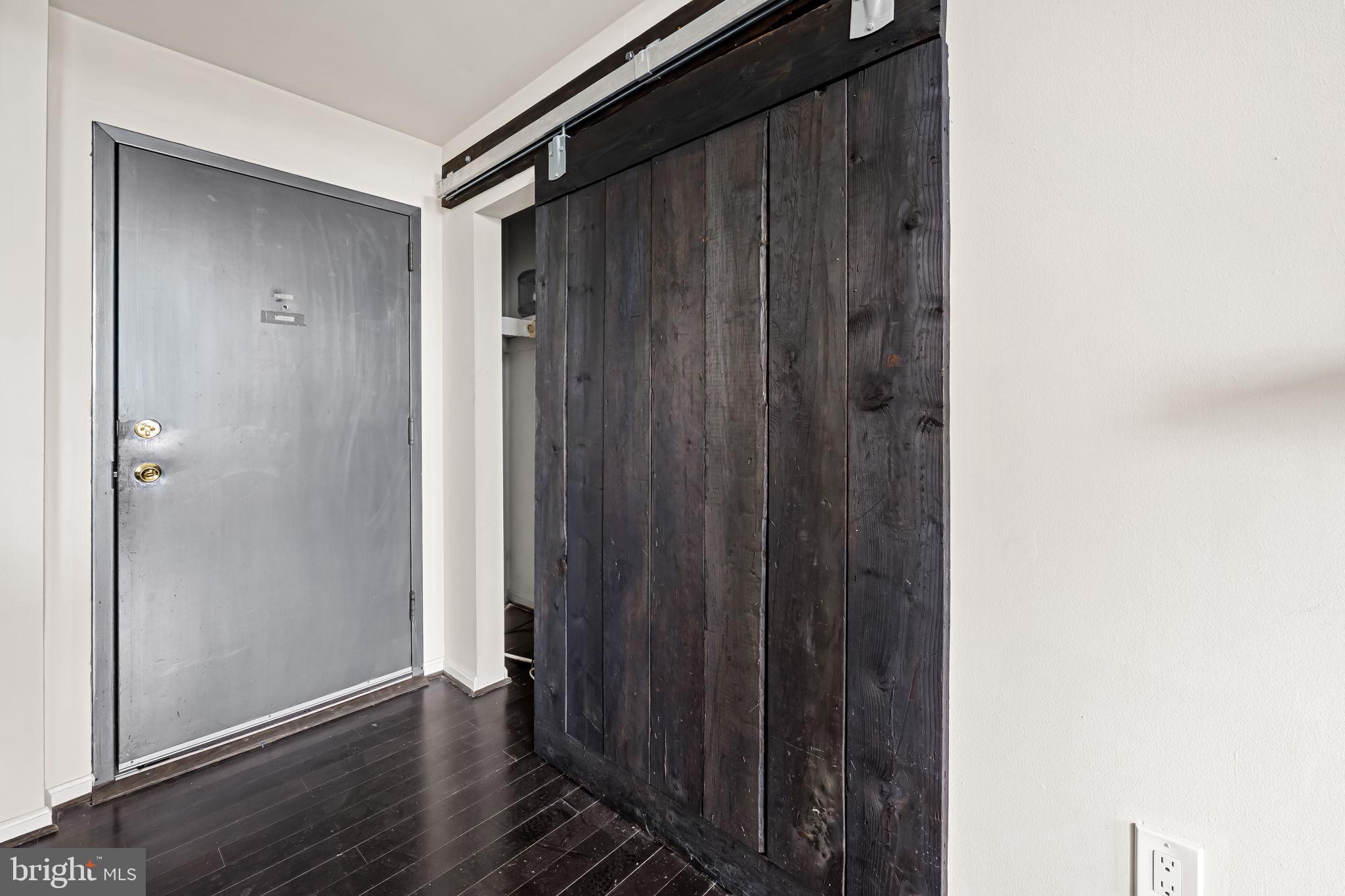 1011 Hunter Street, Unit A4 Baltimore, MD 21202 - Photo 16 of 34 a view of a hallway with wooden floor