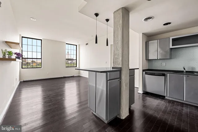 a view of kitchen with furniture and wooden floor