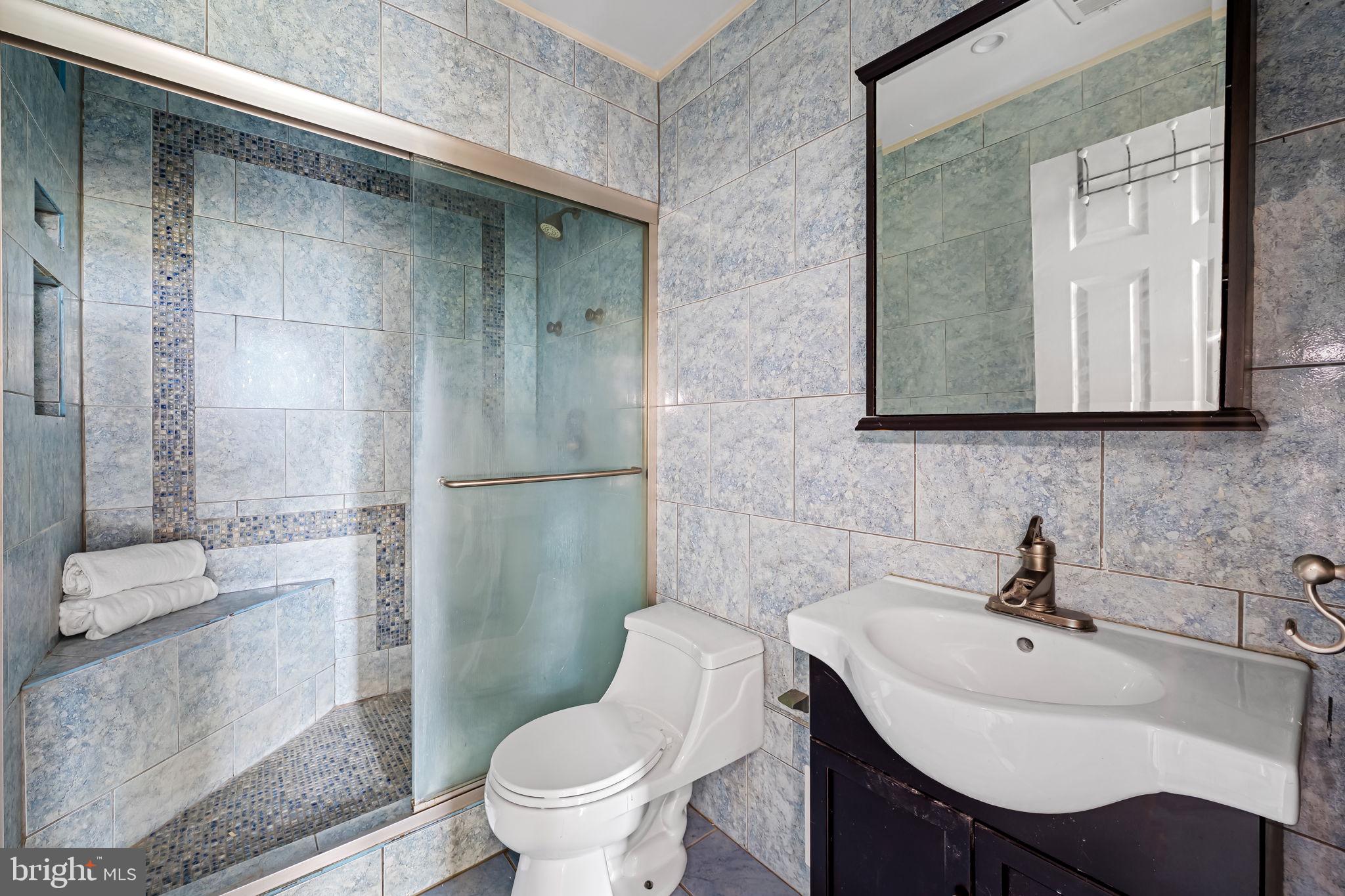 1011 Hunter Street, Unit A4 Baltimore, MD 21202 - Photo 27 of 34 a bathroom with a sink toilet and shower