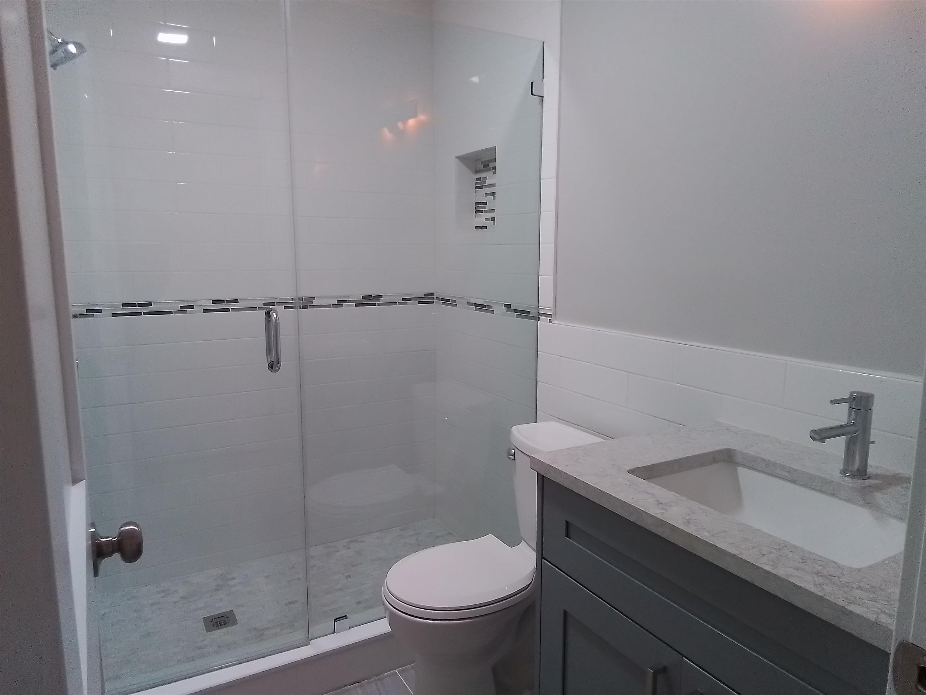 650 West Pope Road, Unit 244 St. Augustine, FL 32080 - Photo 13 of 27 a bathroom with a granite countertop sink a toilet and shower