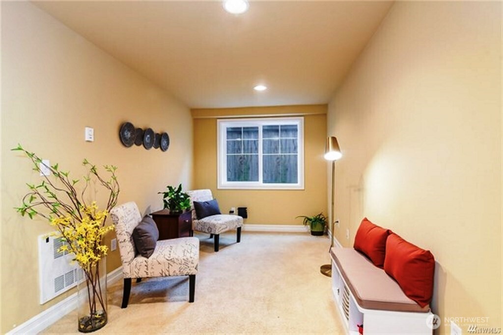 725 North 95th Street, Unit C Seattle, WA 98103 - Photo 15 of 18 a living room with furniture and a large window