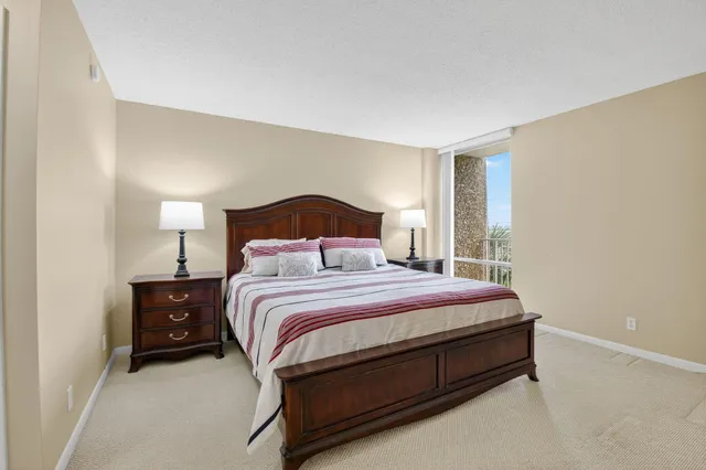 a bedroom with a bed and a night stand