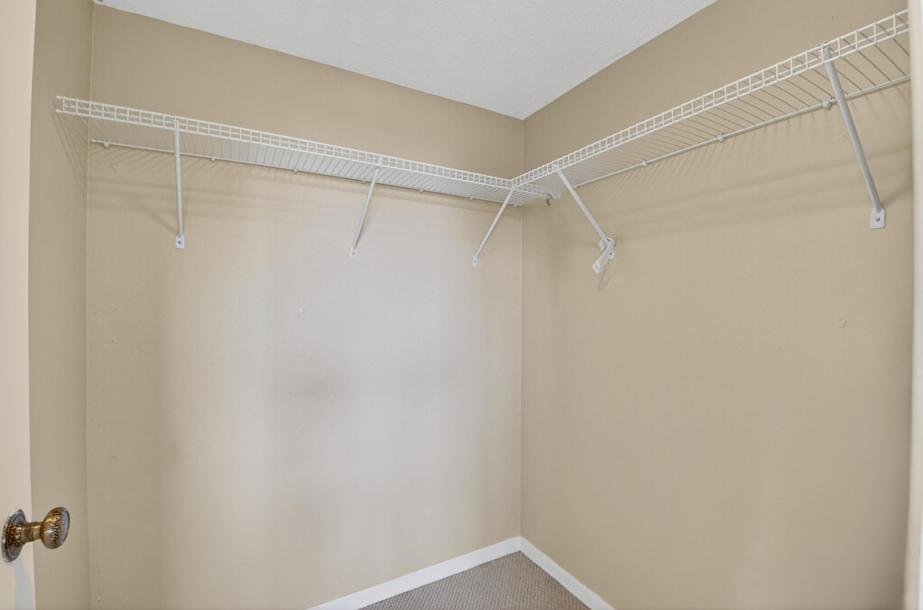 555 Northwest 4th Avenue, Unit 4230 Boca Raton, FL 33432 - Photo 21 of 38 a view of an empty walk in closet
