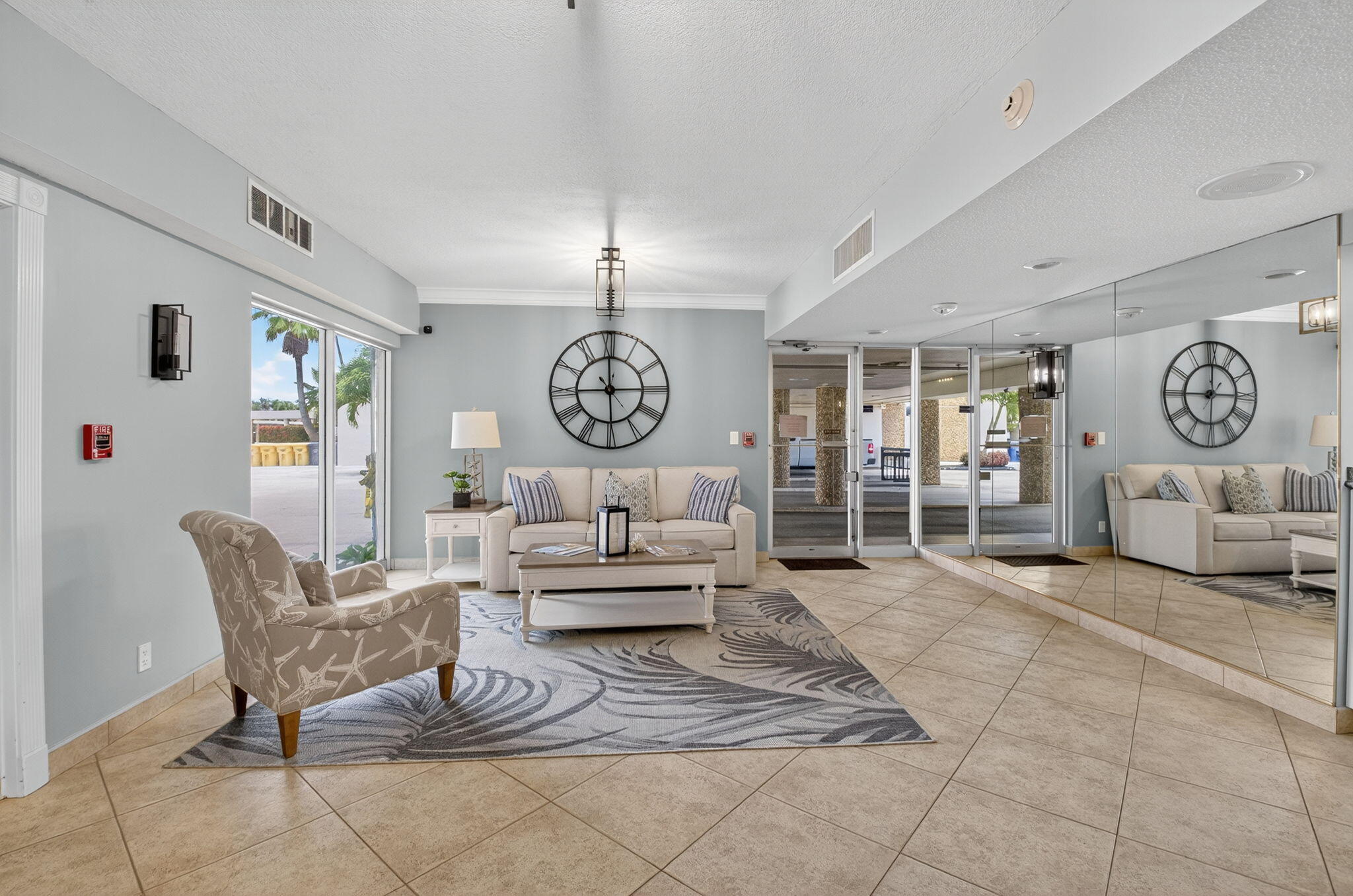 555 Northwest 4th Avenue, Unit 4230 Boca Raton, FL 33432 - Photo 23 of 38 a living room with furniture and a chandelier