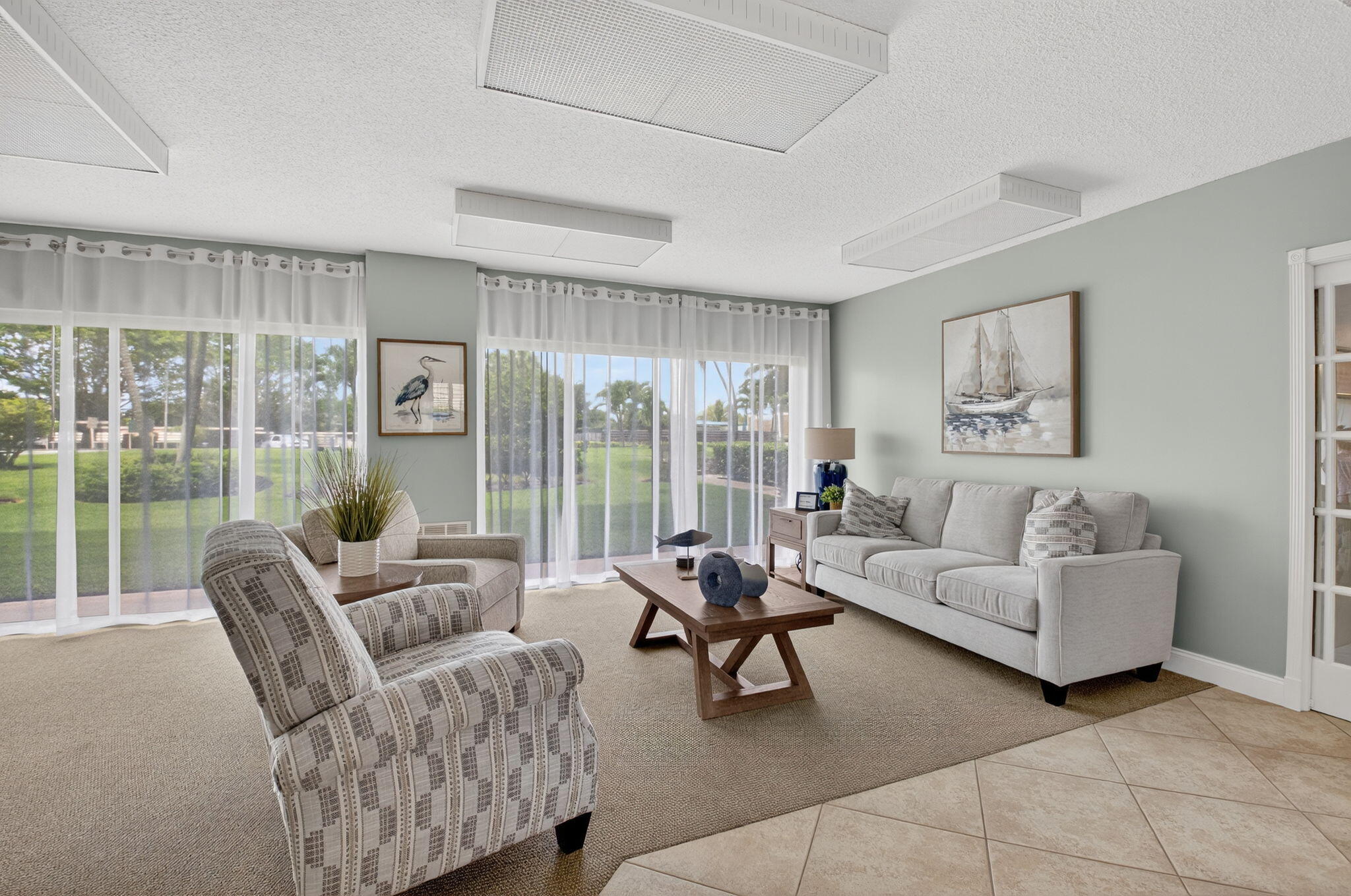 555 Northwest 4th Avenue, Unit 4230 Boca Raton, FL 33432 - Photo 24 of 38 a living room with furniture and a large window